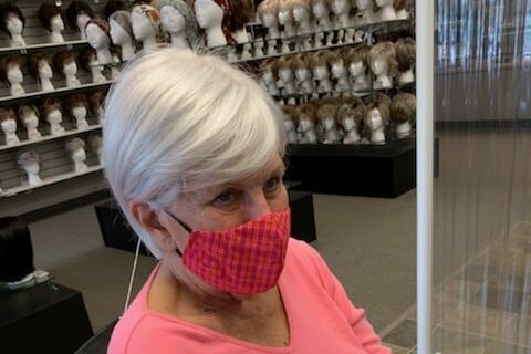 Beth Purcell trying on wigs at the beginning of her chemo treatment