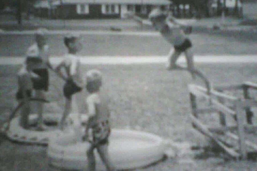 A kid leaping into a pool that's far too shallow